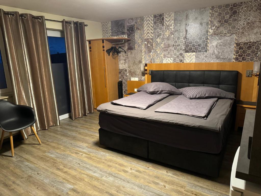Postel nebo postele na pokoji v ubytování Hotel Mythos "Apartments"