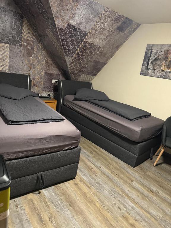 Postel nebo postele na pokoji v ubytování Hotel Mythos "Apartments"