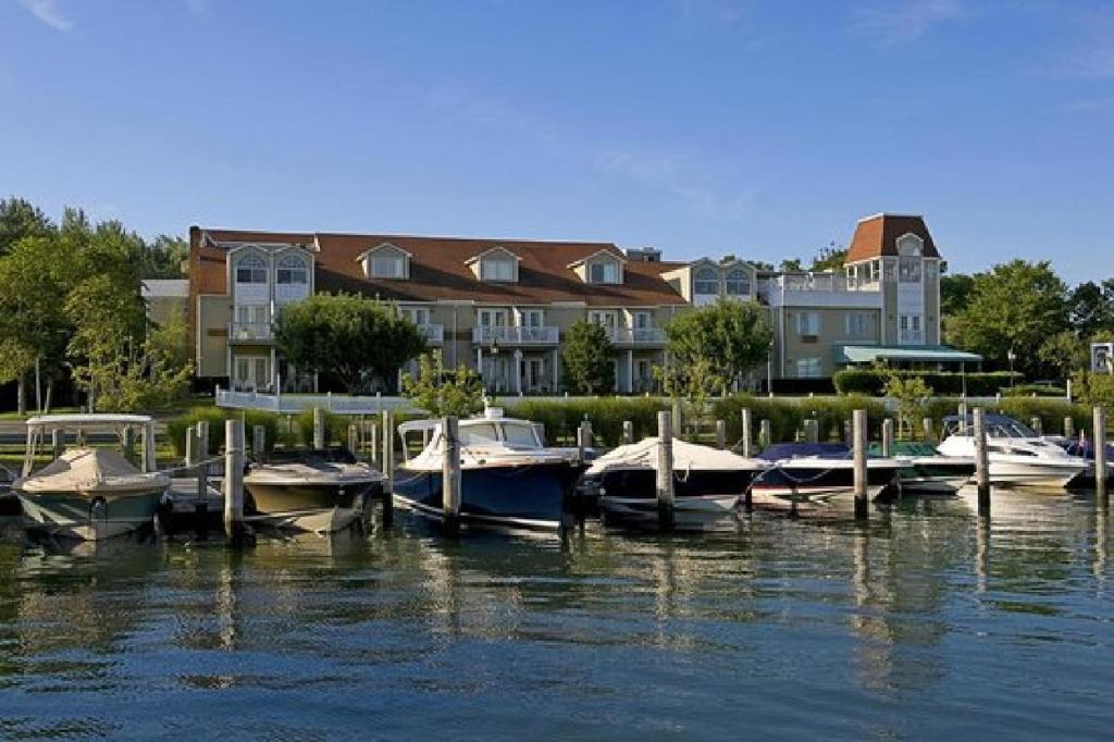 a group of boats docked at a dock in the water at Sag Harbor Inn in Sag Harbor