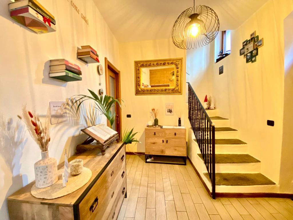 a hallway with a staircase and a stair case at La Casa Del Poeta in Dervio