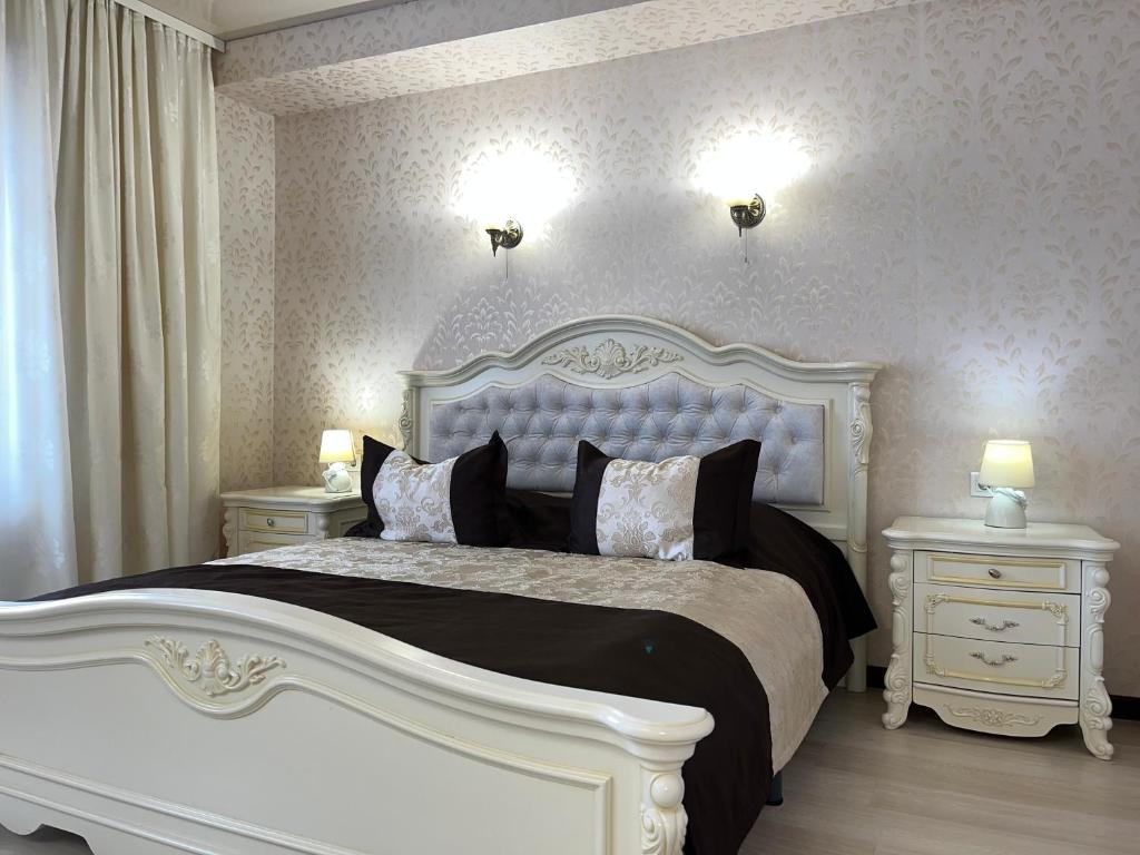 Ліжко або ліжка в номері Maximus hotel