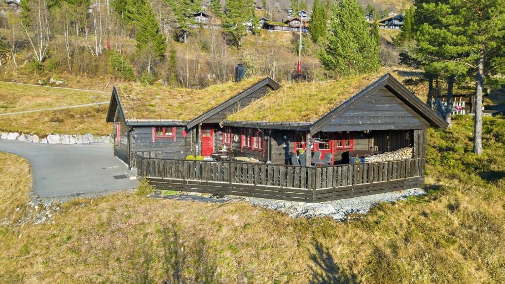 a house with a grass roof on top of it at Hytte Stryn skisenter in Stryn