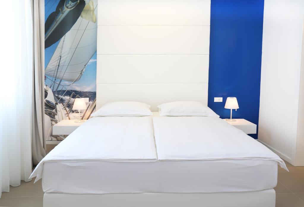 Postel nebo postele na pokoji v ubytování Guesthouse Villa Scalaria