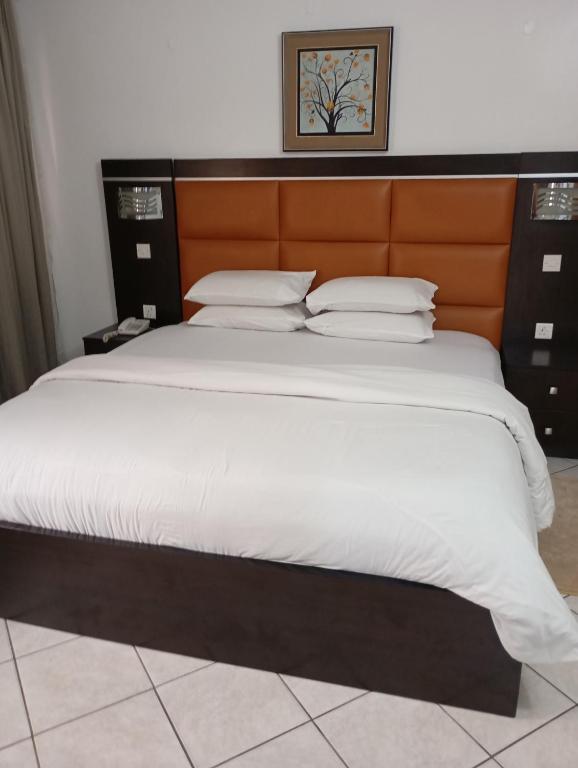 Ένα ή περισσότερα κρεβάτια σε δωμάτιο στο Cata Apartment Hotel And Spa