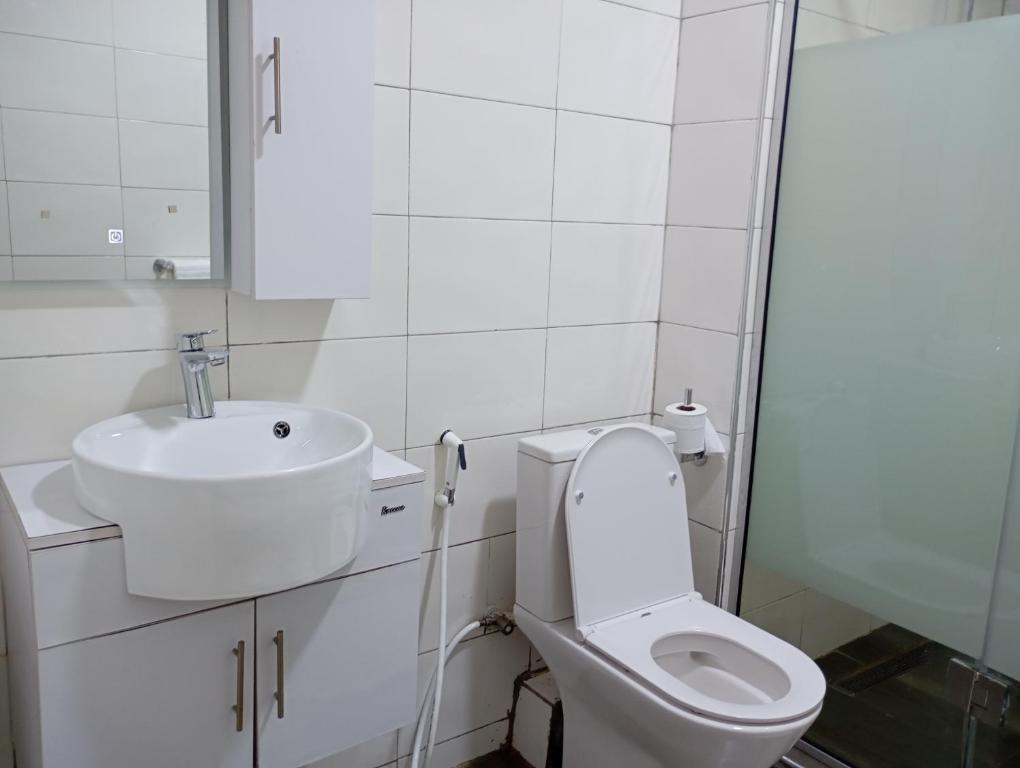 Ένα μπάνιο στο Cata Apartment Hotel And Spa