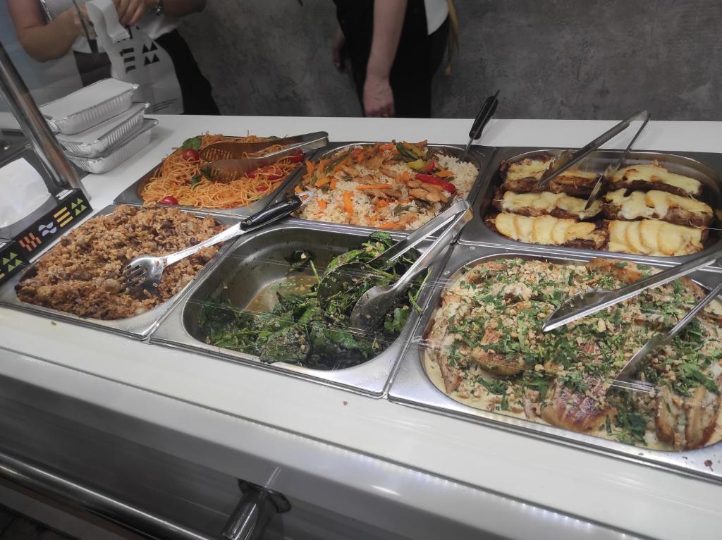 a buffet line with many different types of food at Art tour in Yerevan