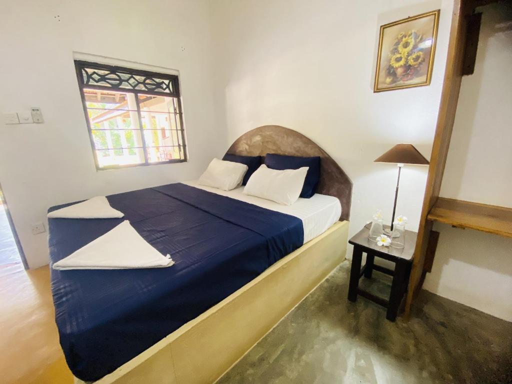 Postel nebo postele na pokoji v ubytování Harmony Beach Hotel