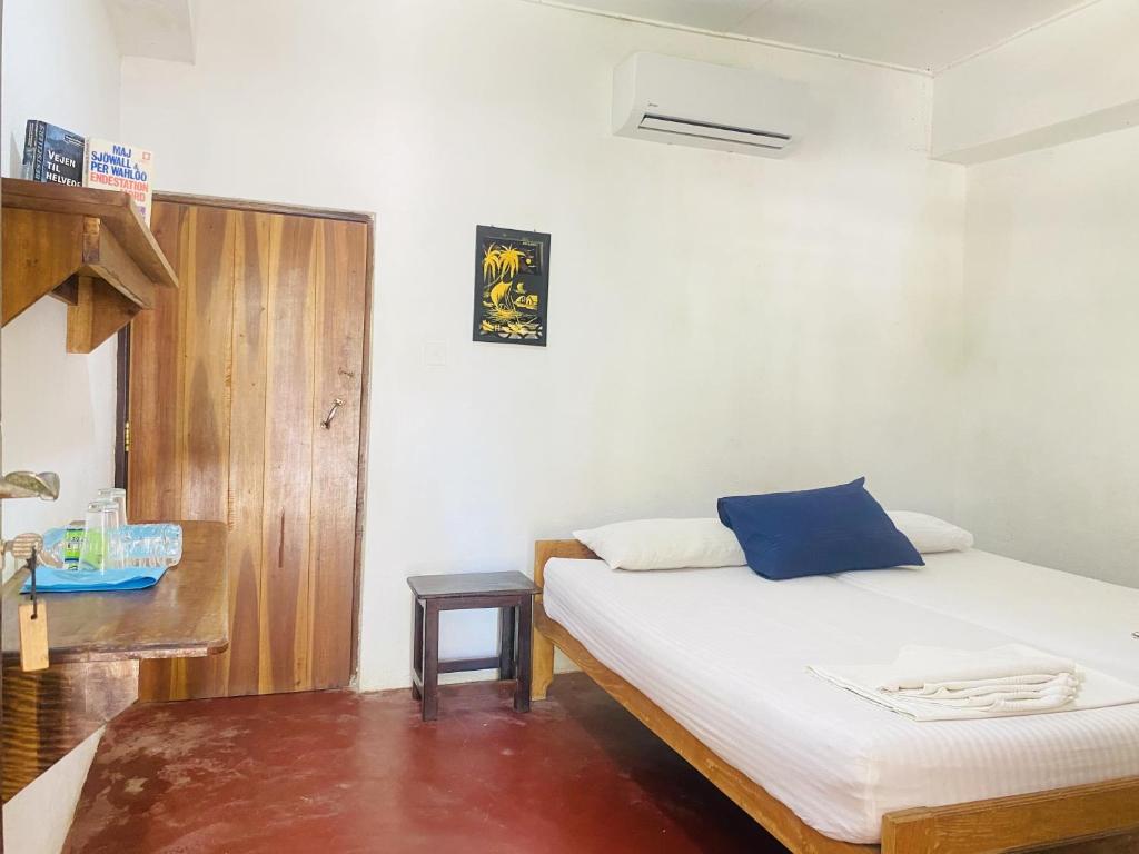 Postel nebo postele na pokoji v ubytování Harmony Beach Hotel