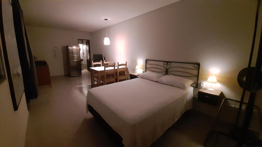 Кровать или кровати в номере Studio Pitangueiras