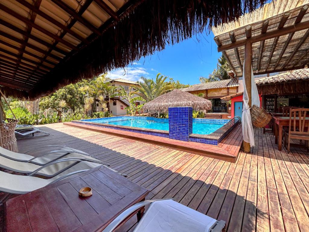 a resort with a swimming pool and a patio at Viking Inn - Canto Afetos - Taipú de Fora - Barra Grande - Península de Maraú in Barra Grande