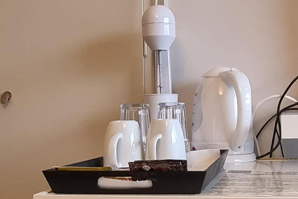 a tray of appliances sitting on top of a table at Irene Vìlla in Poros