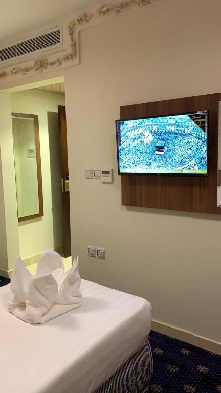 TV a/nebo společenská místnost v ubytování فندق انوار المشاعرالفندقية