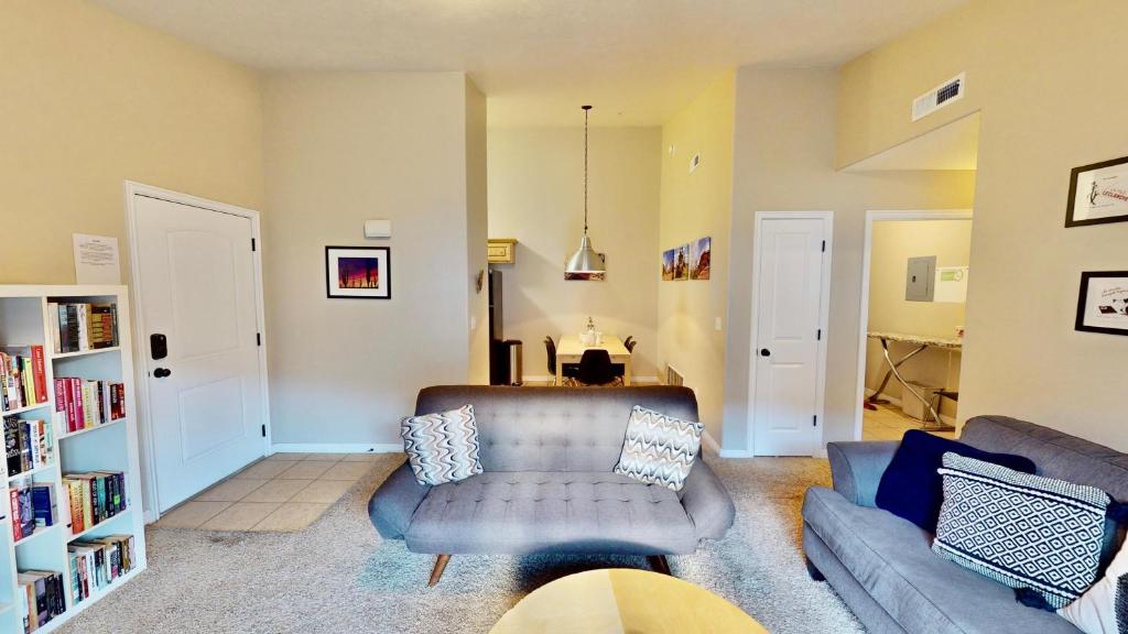 a living room with a couch and a chair at Red Cliff Condos #3i in Moab