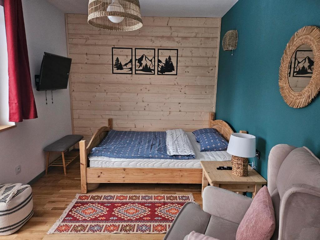 En eller flere senger på et rom på Willa Szewcula Apartament Skrzyczne