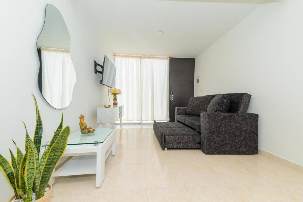 a living room with a couch and a table at Chic 2Bedroom in Cúcuta in Villa del Rosario