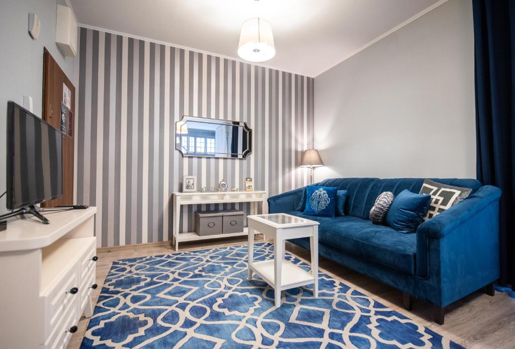TV a/nebo společenská místnost v ubytování City Lights Topolowa 8