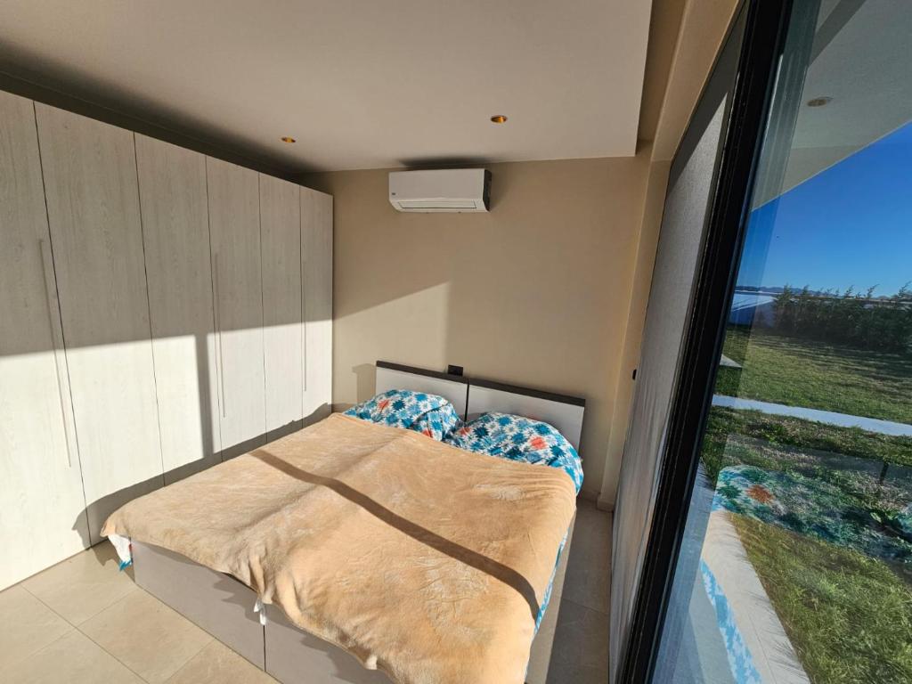 Postel nebo postele na pokoji v ubytování Sunrise Villa