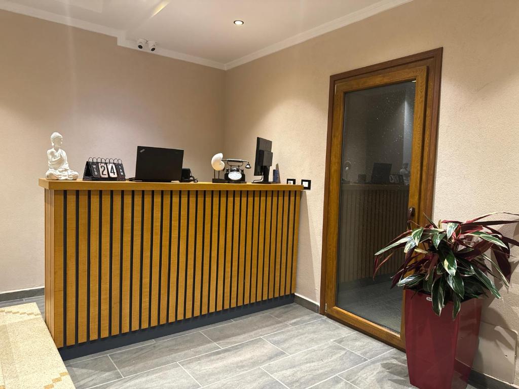TV a/nebo společenská místnost v ubytování Hotel Gjika