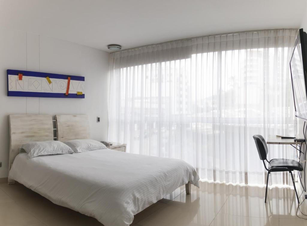 Postel nebo postele na pokoji v ubytování Monterosa Apartamentos Amoblados