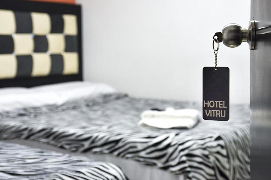 Postel nebo postele na pokoji v ubytování HOTEL VITRU