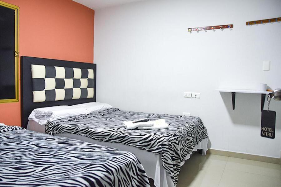 Postel nebo postele na pokoji v ubytování HOTEL VITRU