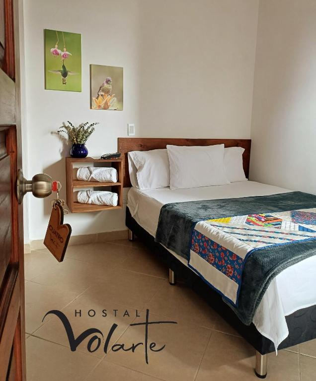 Postel nebo postele na pokoji v ubytování Volarte Hostal
