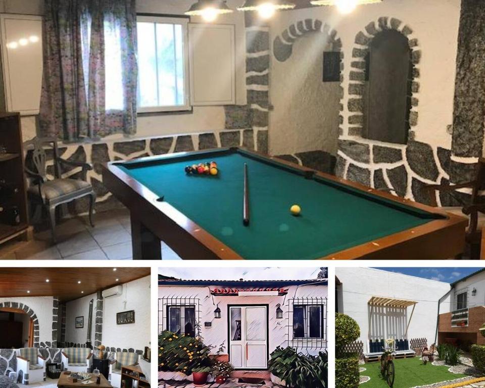 a room with a pool table and a miniature house at Refúgio Saloio- LugarTranquilo às Portas de Lisboa in Lousa