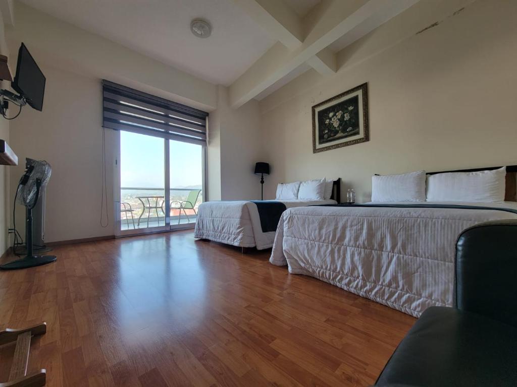 Postel nebo postele na pokoji v ubytování HOTEL TRUEBA