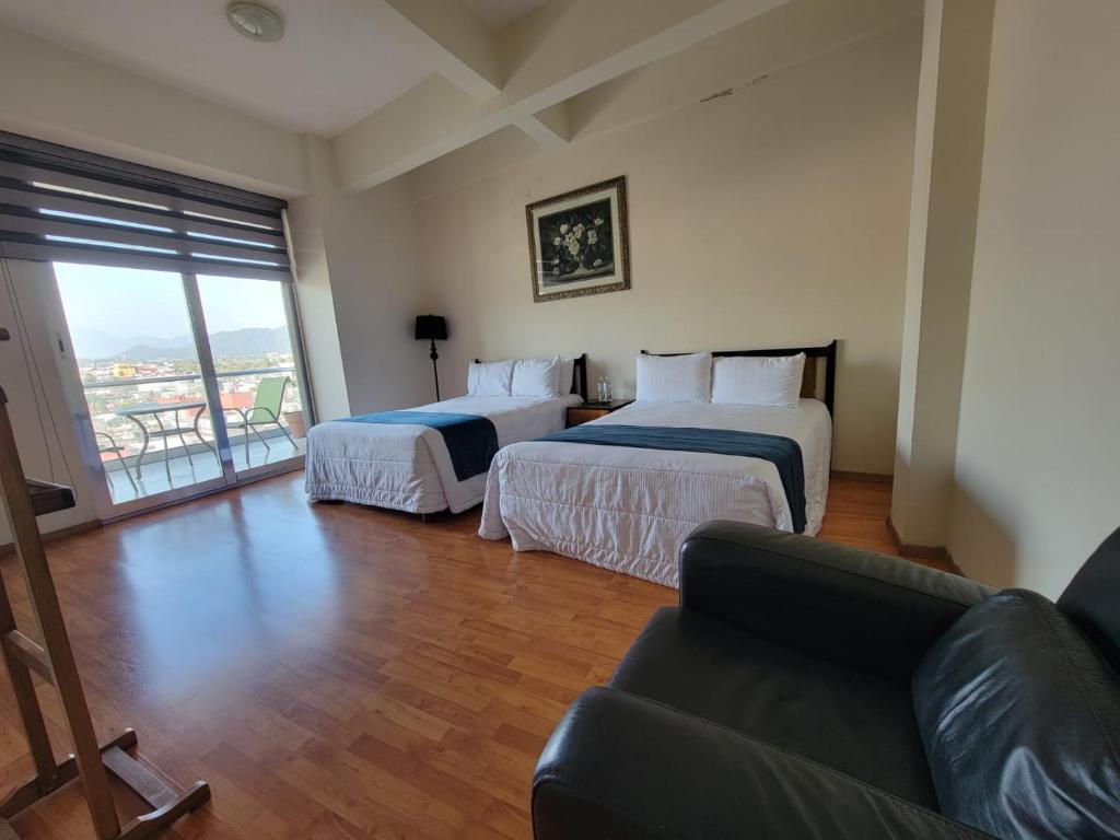Postel nebo postele na pokoji v ubytování HOTEL TRUEBA