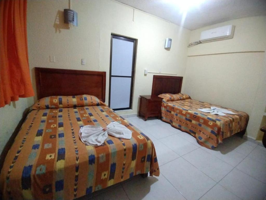 Postel nebo postele na pokoji v ubytování Hotel Puerto Real-Minatitlán