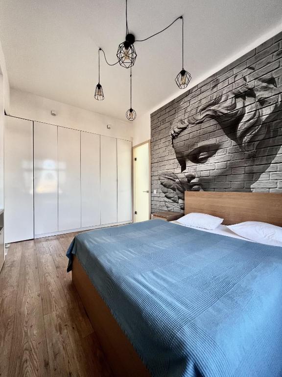 Un pat sau paturi într-o cameră la BpHomes