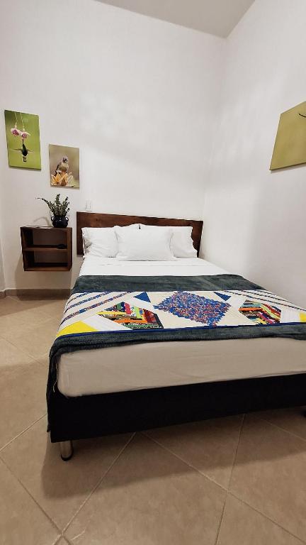Postel nebo postele na pokoji v ubytování Volarte Hostal