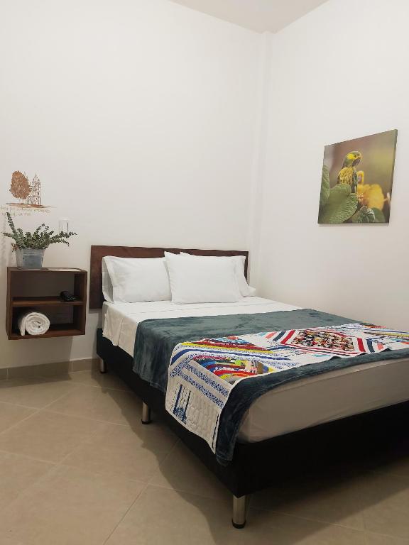 Postel nebo postele na pokoji v ubytování Volarte Hostal