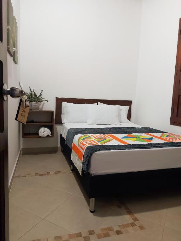 Postel nebo postele na pokoji v ubytování Volarte Hostal