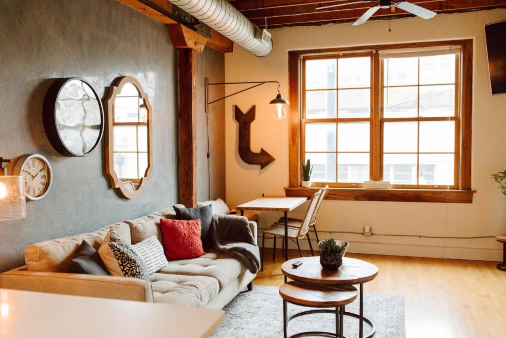 a living room with a couch and a table at Broken Clock in Springfield