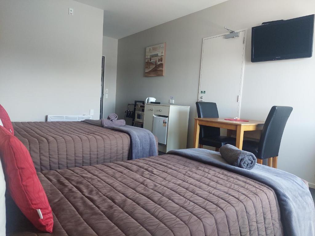 Postel nebo postele na pokoji v ubytování Northpark Motel
