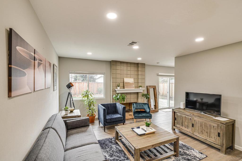 a living room with a couch and a tv at Stylish San Jose Retreat - 7 Mi to Downtown in San Jose