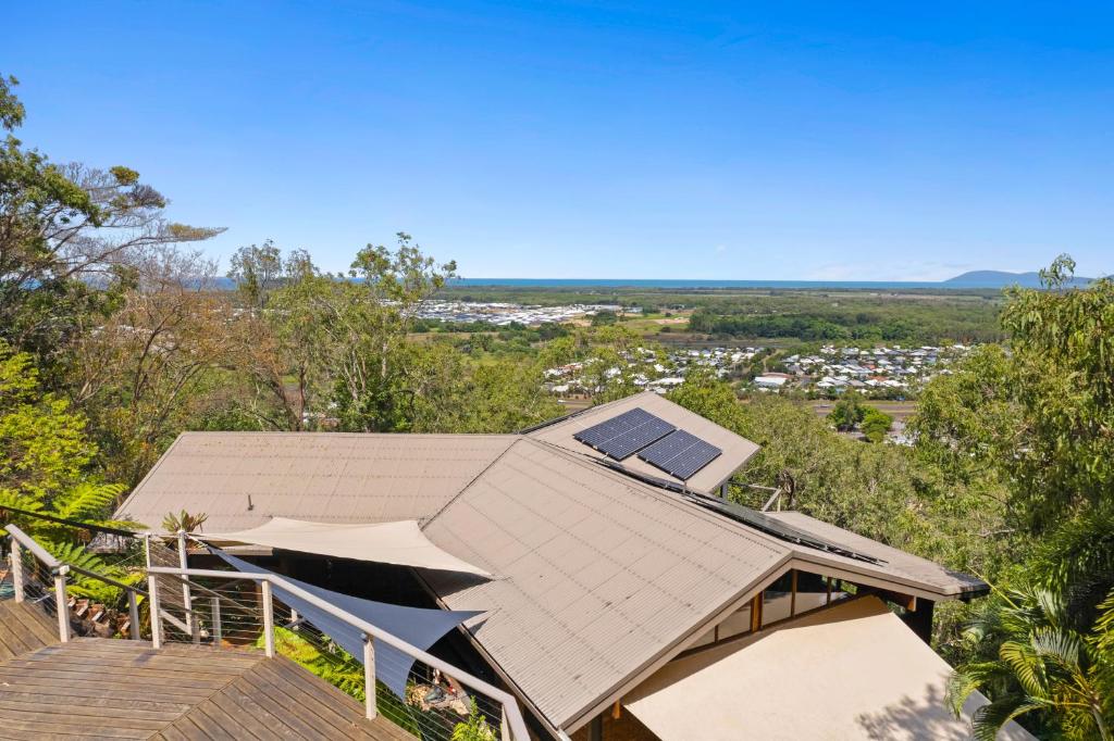 an overhead view of a house with a roof at Rainforest Treehouse Sanctuary - with ocean views in Smithfield