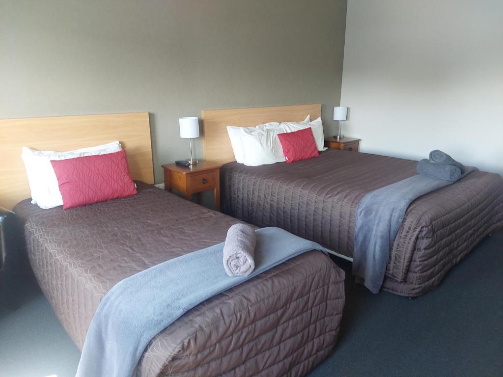 Postel nebo postele na pokoji v ubytování Northpark Motel