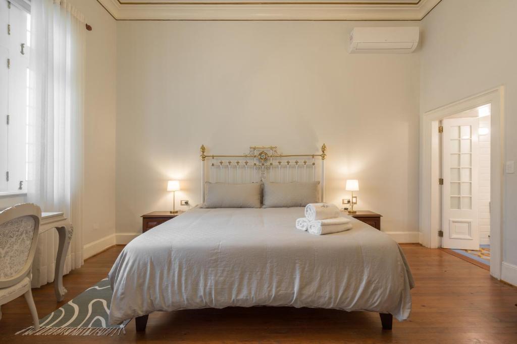 Postel nebo postele na pokoji v ubytování Casa Cáceres