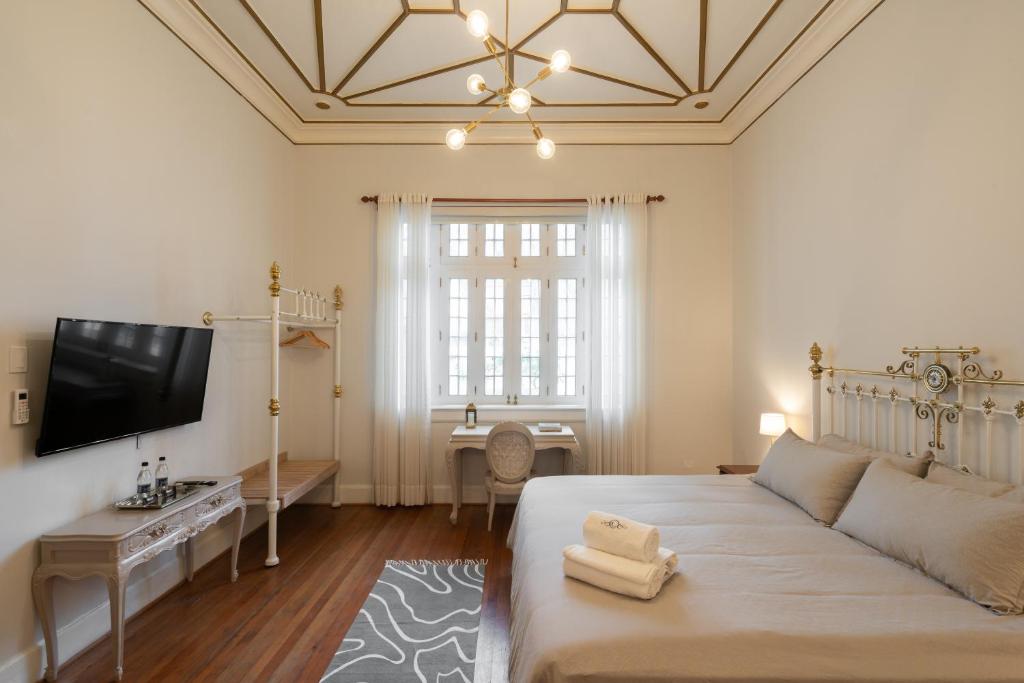 Postel nebo postele na pokoji v ubytování Casa Cáceres