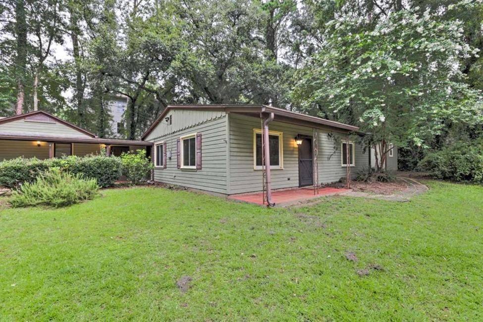 a small green house with a grass yard at Escambia in Tallahassee
