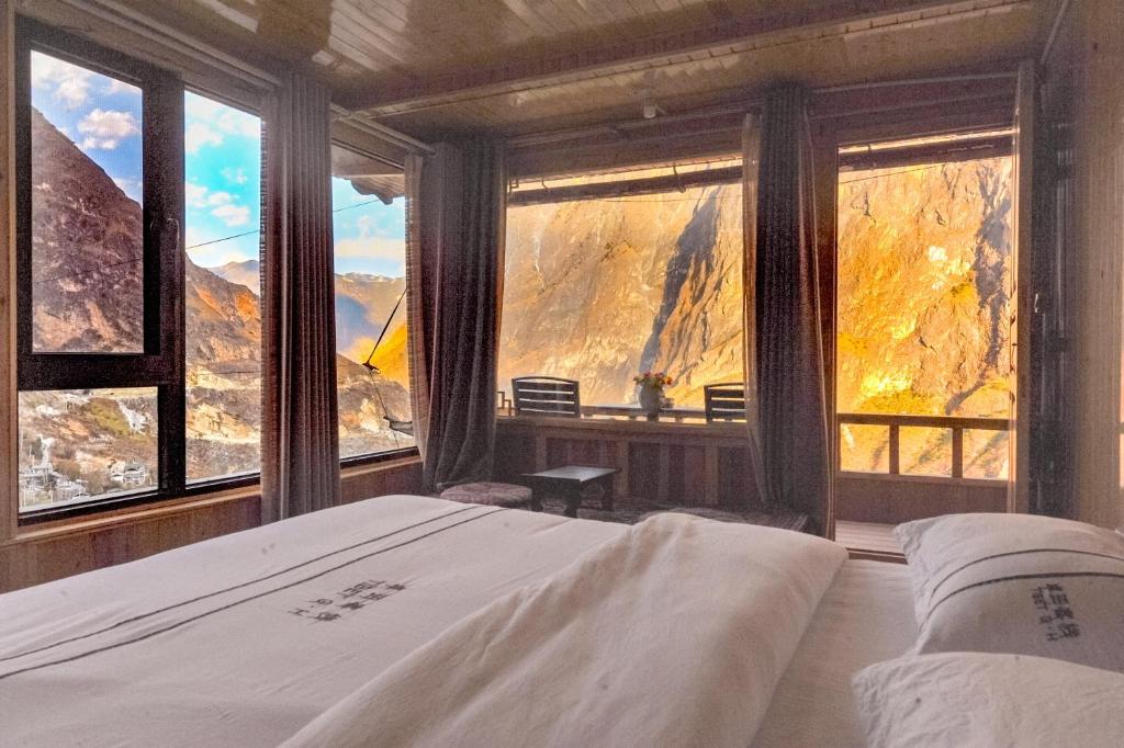Postel nebo postele na pokoji v ubytování TIBET Guest house 虎跳峡卓玛客栈