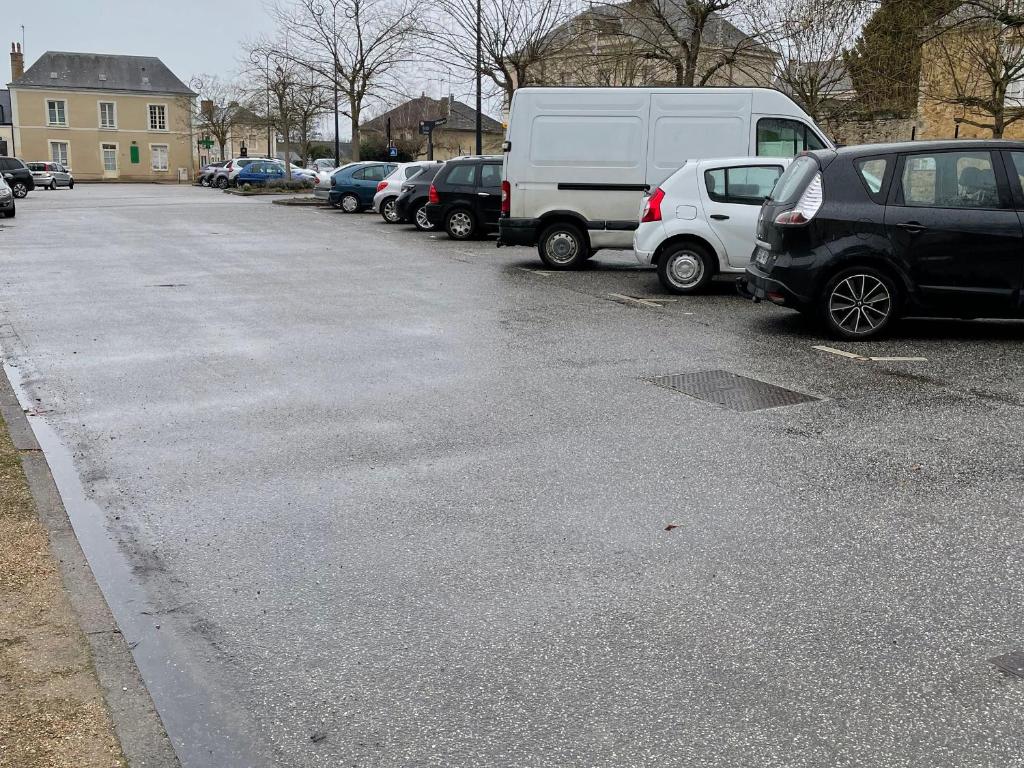 a parking lot with a bunch of cars parked at Gîte Bazouges-sur-le-Loir, 6 pièces, 10 personnes - FR-1-410-377 in Bazouges-sur-le-Loir