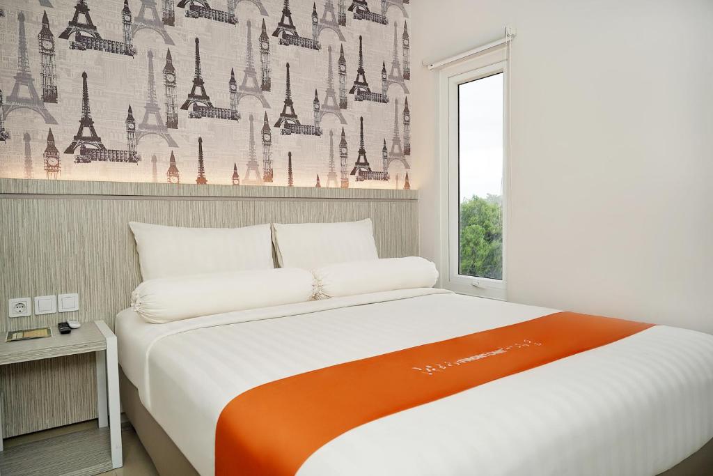 Letto o letti in una camera di Front One Hotel Sragen