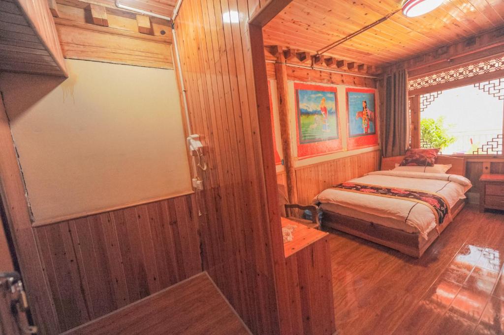 Postel nebo postele na pokoji v ubytování TIBET Guest house 虎跳峡卓玛客栈
