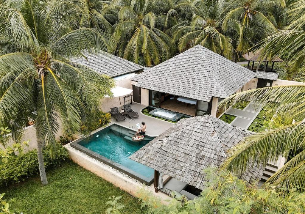 an aerial view of a house with a swimming pool at Sheraton Hua Hin Pranburi Villas in Pran Buri