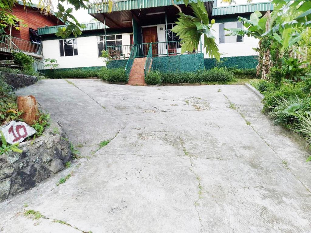 an empty driveway in front of a house at Elizabeth Accomodation-Your Home Away from Home in Suva