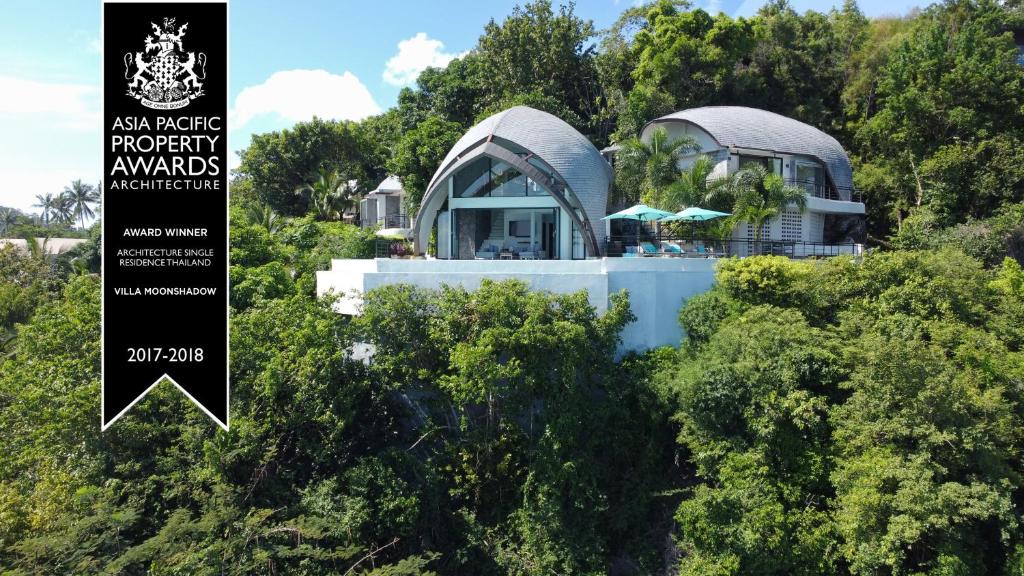 a house in the middle of the trees at Villa Moonshadow - Multiple Award Winning Villa in Chaweng Noi Beach