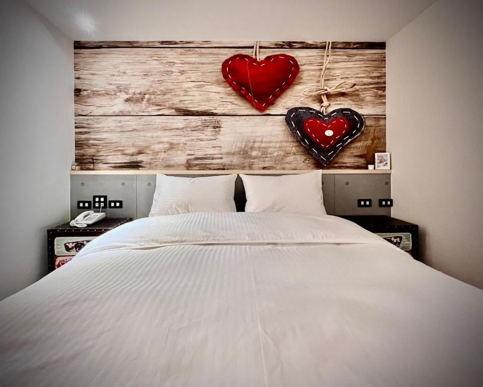 Postel nebo postele na pokoji v ubytování Good Time Boutique Hotel